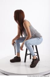 MOLLY SITTING POSE WITH GUN 2